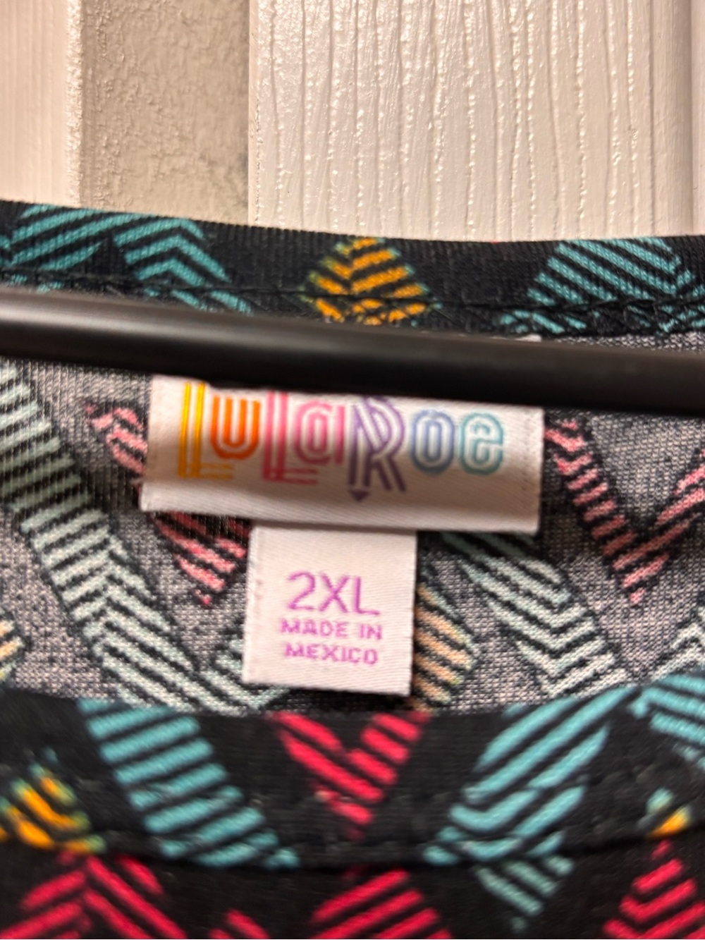 LuLaRoe Short Sleeve Knit Shirt in Black with Teal, Pink & Yellow Accents - Picture 2 of 3